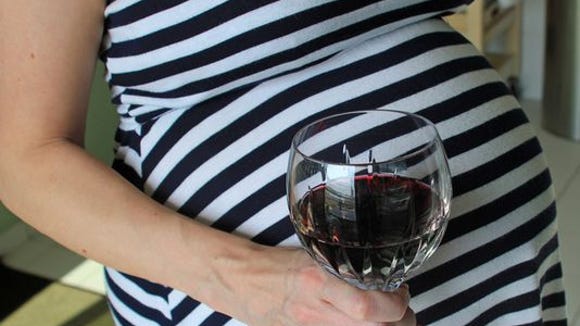   Pregnant woman drinks wine getty 