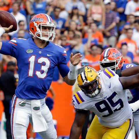 Florida quarterback Feleipe Franks (13) throws a p