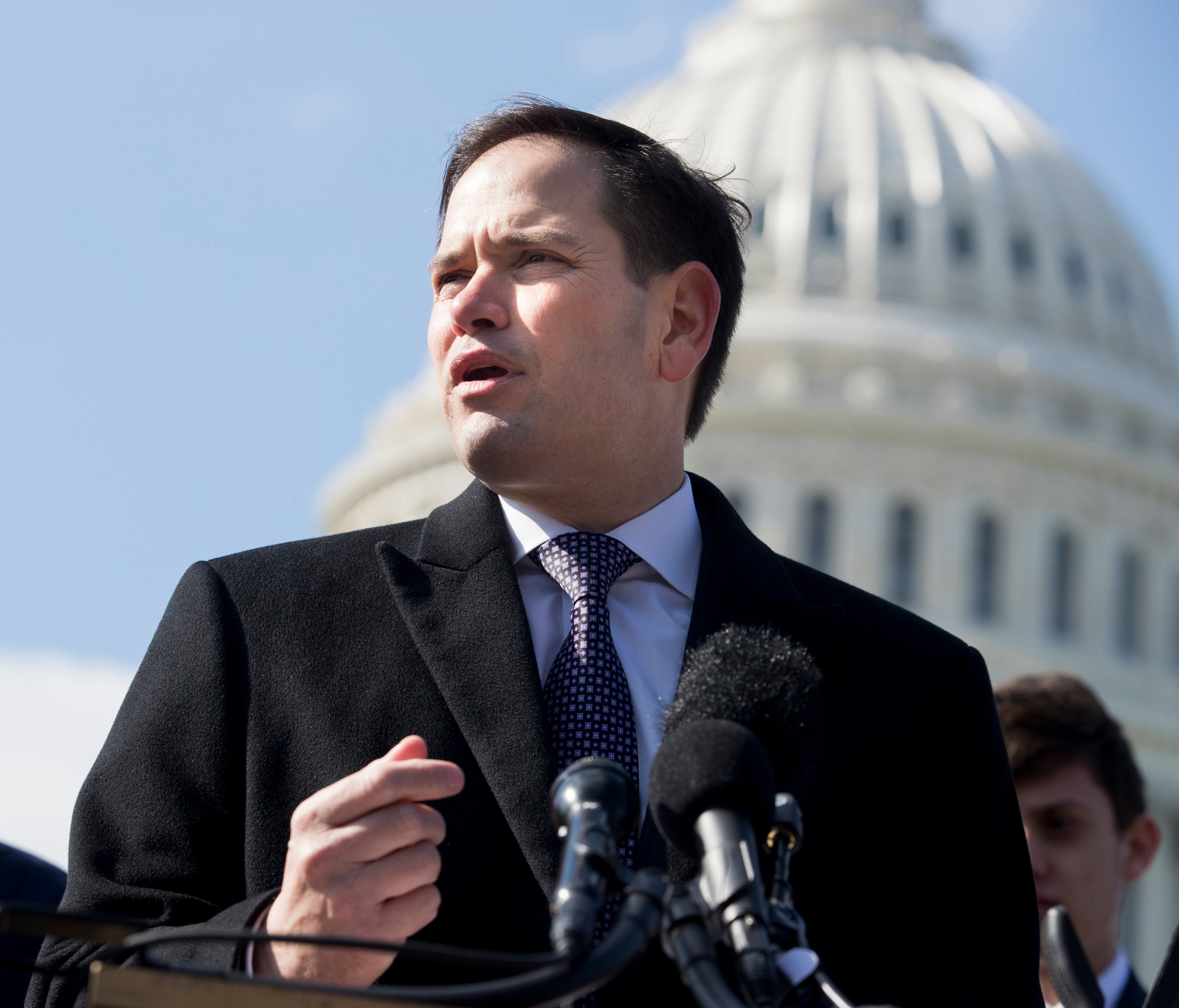 Republican Senator from Florida Marco Rubio speaks in front of Marjory Stoneman Douglas High School student Patrick Petty (L), during a news conference held to introduce the 'Students, Teachers, and Officers Preventing (STOP) School Violence Act of 2