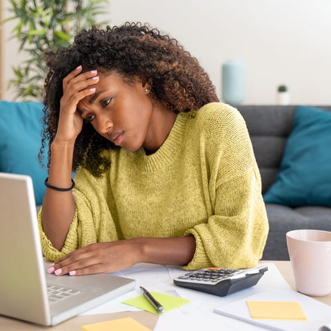 Adult looking at financial paperwork.