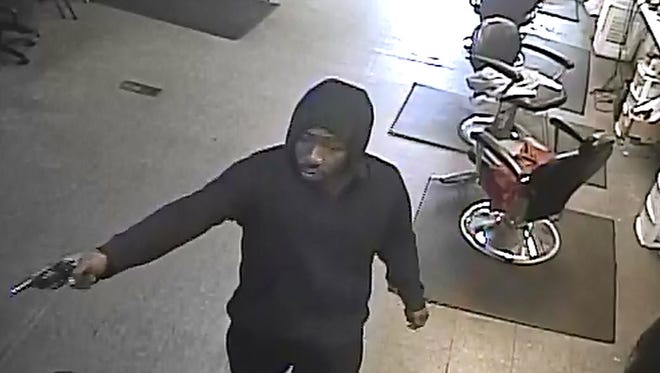 Detroit Police seek 2 men in barber shop robbery