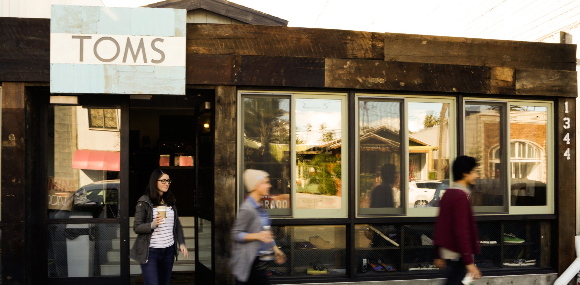 A boho shoe-in: Commerce meets community in Toms' casual, rustic new retail  space