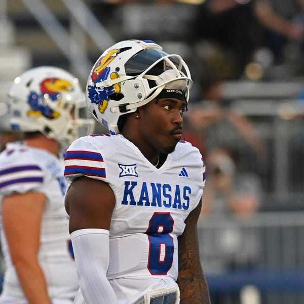 Kansas quarterback Jalon Daniel walks on the field before the team's NCAA college football game against Nevada on Saturday, Sept. 16, 2023, in Reno, Nev. (AP Photo/Andy Barron)