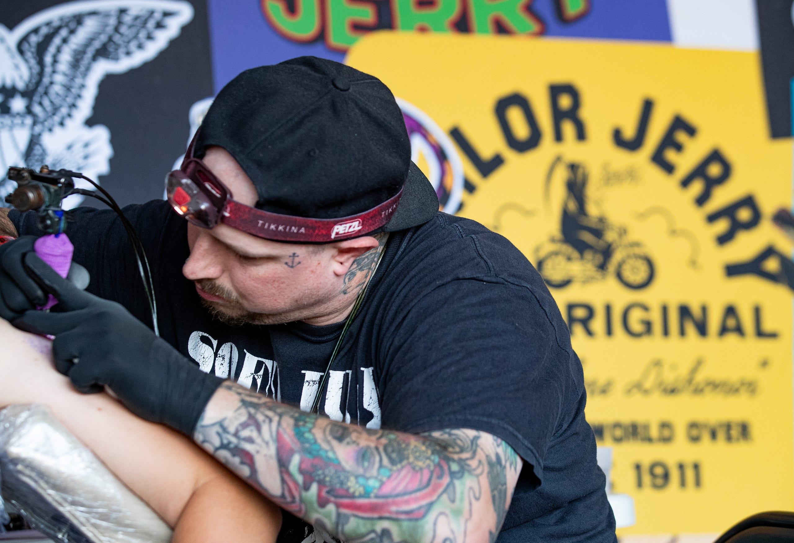 Tattoo artist Christopher Waugh inks Chef Heske at the Louder Than Life music festival on Friday, Sept. 22, 2023 JEFF FAUGHENDER/COURIER JOURNAL AND USA TODAY NETWORK
