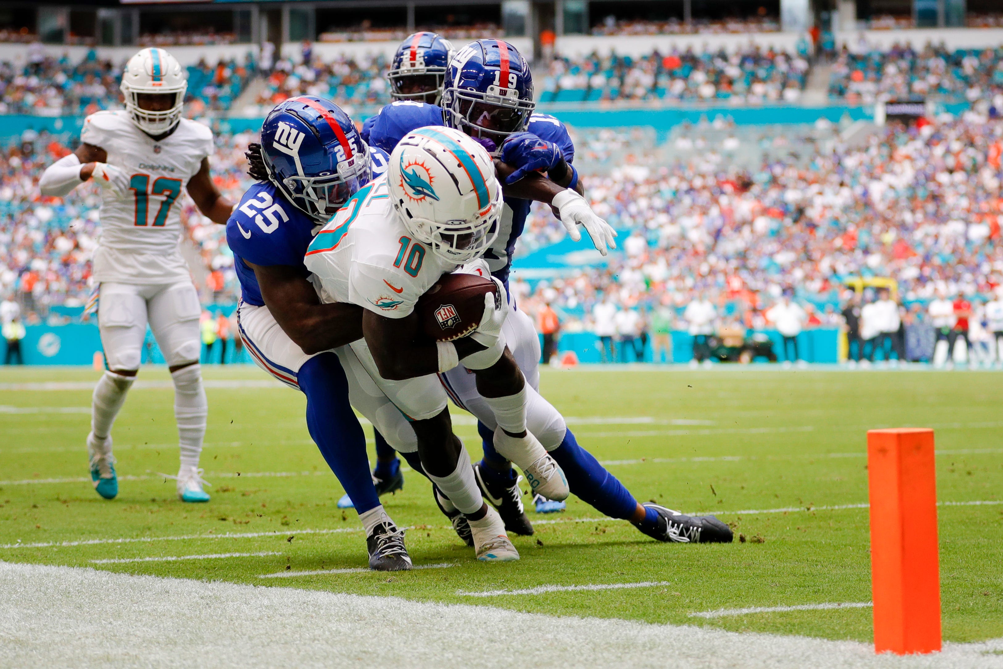 Miami Dolphins linebacker Jerome Baker (55) and safety Brandon Jones (29)  tackle Pittsburgh Steelers running back Najee Harris (22) during the second  half of an NFL football game, Sunday, Oct. 23, 2022