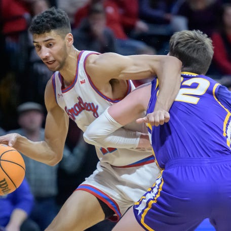 Bradley's Malevy Leons, left, tangles with UNI's Kyle Pack in the first half of their Missouri Valley Conference basketball game Wednesday, Jan. 31, 2024 at Carver Arena in Peoria.