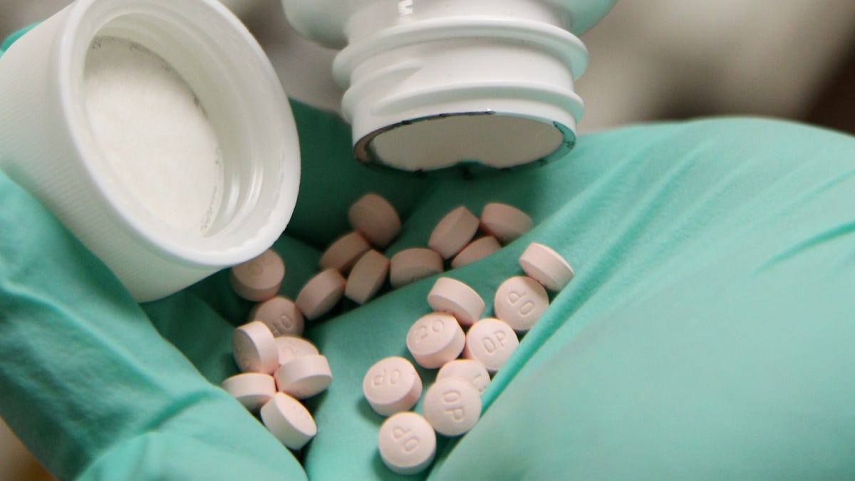 A pharmacist holds OxyContin pills made by Purdue Pharma at a pharmacy in Provo, Utah, U.S., May 9, 2019.