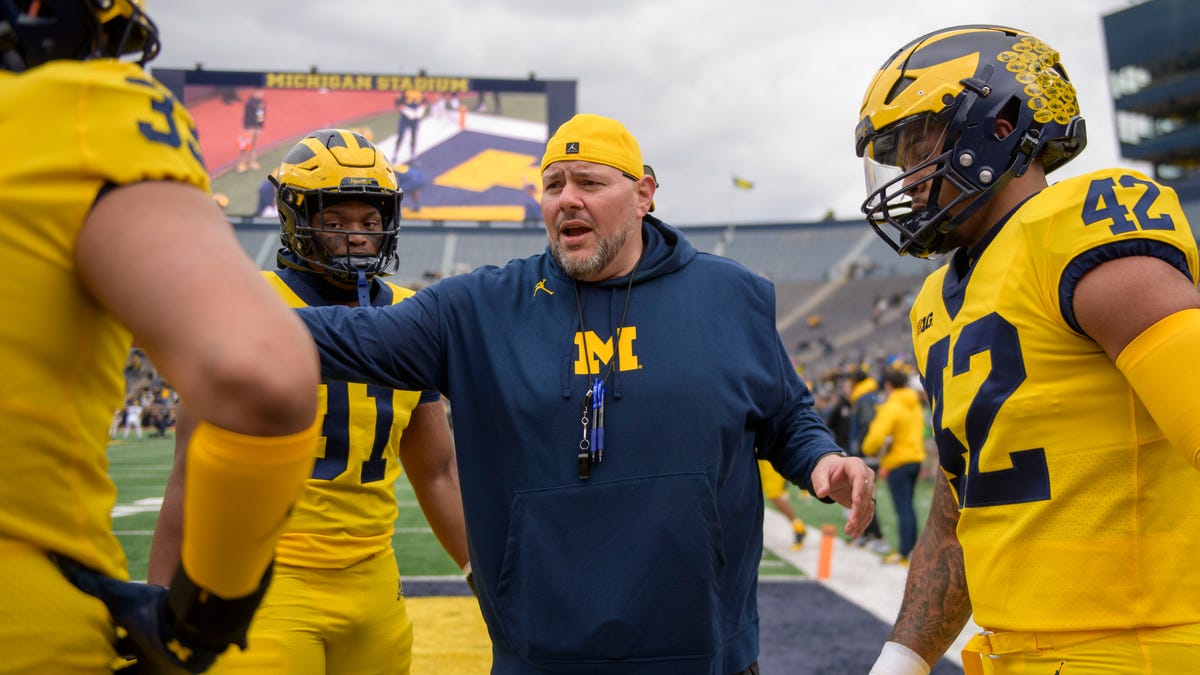 New Michigan football coaches report to recruiting tour