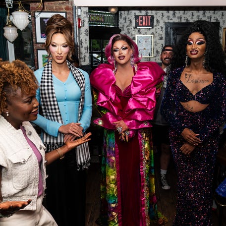White House Press Secretary Karine Jean-Pierre, left, speaks with the cast of RuPaul's Drag Race All Stars Season 9 at The Little Gay Pub in Washington, D.C. on May 6, 2024.