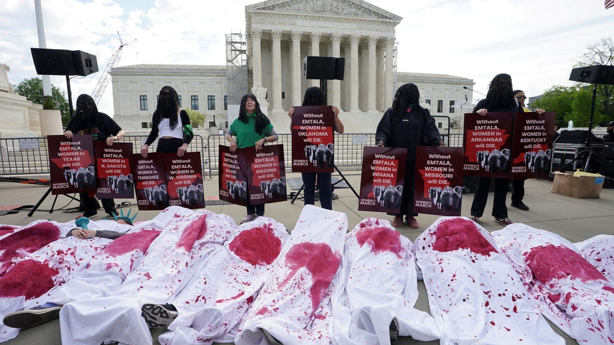 Abortion rights supporters stage a "die-in" protest in support of reproductive rights and emergency abortion care, on the day the Supreme Court justices hear oral arguments over the legality of Idaho's Republican-backed, near-total abortion ban in medical-emergency situations, in Washington, U.S., April 24, 2024. REUTERS/Kevin Lamarque