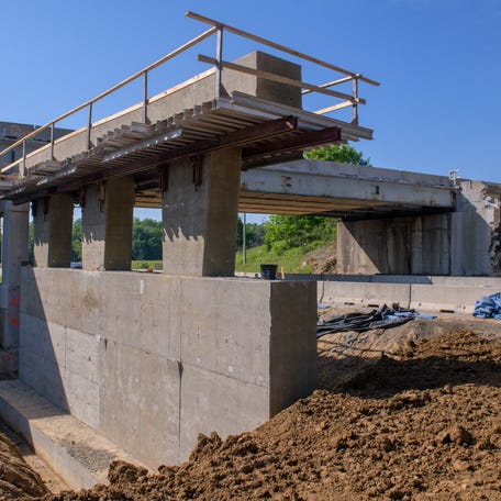The center pier of the northbound lanes of the Airport Road overpass at Interstate 474, currently under reconstruction, sits on naturally-formed base of underground rock.