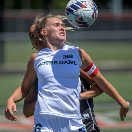 Peoria Notre Dame's Mya Wardle chest-bumps the ball as the Irish battle Richwoods in the second period of their Class 2A soccer sectional title match Saturday, May 25, 2024 in Washington. The Irish advanced to the Kankakee Supersectional with a 1-0 victory.