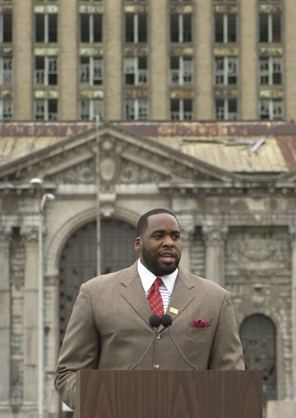 Mayor Kwame Kilpatrick at a March 3, 2004 press conference announces a proposal to move the city's police headquarters to Michigan Central Depot.