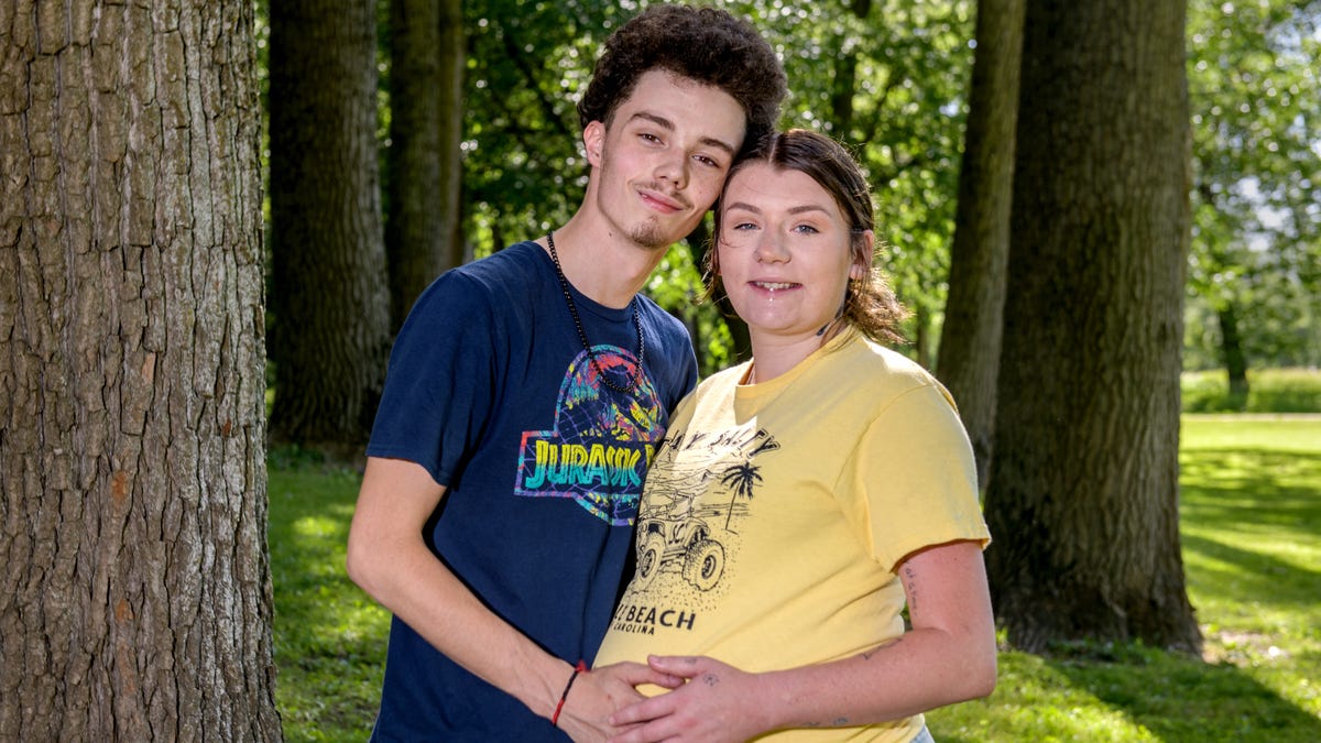 Aaron Bencher, left, 19, and his girlfriend Catherine Judah, 23, pose for a photo in a park in Spring Bay. Bencher was severely beaten in April by three men at his home in Spring Bay in what is believed to be a case of mistaken identity. Judah, who is eight months pregnant, walked in on the beating and the men ran off.