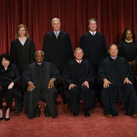The Supreme Court from left, Justices Sonia Sotomayor, Amy Coney Barrett, Clarence Thomas and Neil Gorsuch, Chief Justice John Roberts, and Justices Brett Kavanaugh, Samuel Alito, Ketanji Brown Jackson and Elena Kagan.