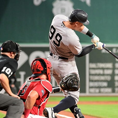 Sep 14, 2023; Boston, Massachusetts, USA; New York Yankees designated hitter Aaron Judge (99) hits a three run home run during the second inning against the Boston Red Sox at Fenway Park. Mandatory Credit: Eric Canha-USA TODAY Sports