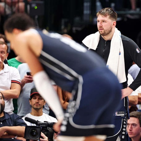 Luka Doncic looks on during the Mavericks' Game 3 loss to the Celtics at American Airlines Center.