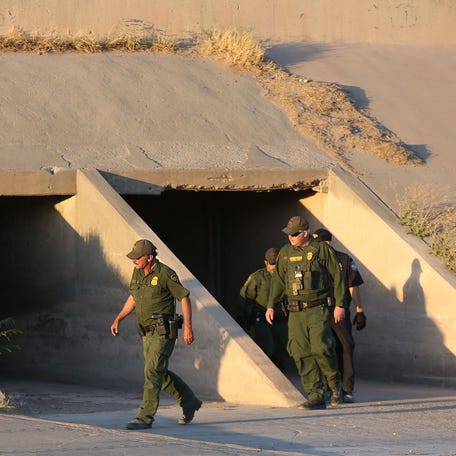 Border Patrol agents check a tunnel in the Rio Grande basin between El Paso and Juarez as they searched for asylum seekers in 2019.