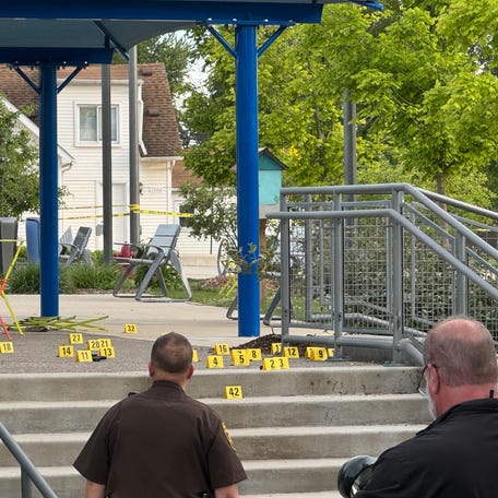 Law enforcement officers were investigating the crime scene following a mass shooting at Brooklands Plaza Splash Pad in Rochester Hills on Saturday, June 15, 2024.