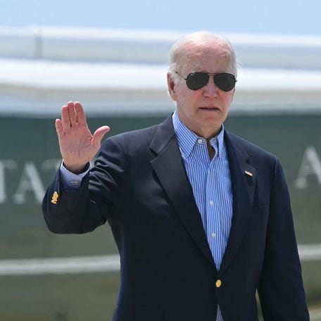President Joe Biden is pictured stepping off Marine One to board Air Force One at Los Angeles International Airport.