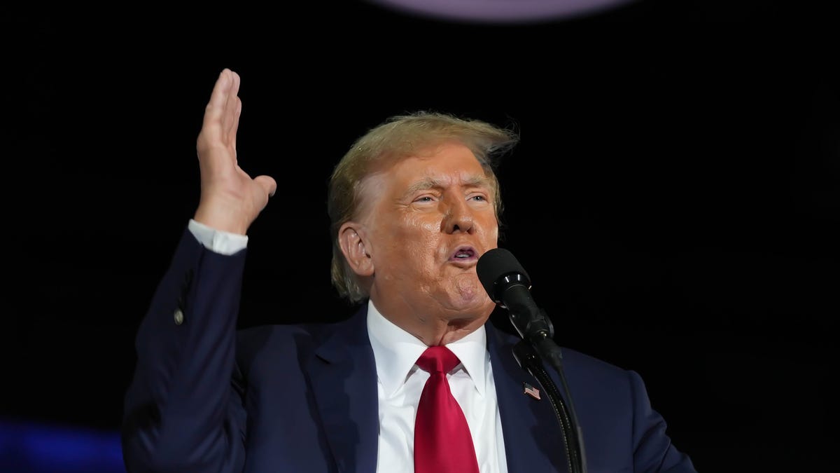 Former President Donald Trump gestures as he speaks before members of the Club 47 group at the Palm Beach County Convention Center on June 14, 2024, in West Palm Beach, Florida.