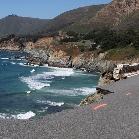 A hole is visible where a section of southbound Highway 1 broke off and fell in the ocean at Rocky Creek Bridge on April 02, 2024 near Big Sur, California. A section of California's famed Highway 1 collapsed into the ocean following heavy rains.