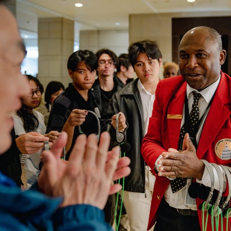 Tour guide Joseph Atou, 50, is thanked by tourists as they conclude a tour of the U.S. Capitol in Washington, D.C., on April 17, 2024. Credit: Shuran Huang-USA TODAY ORG XMIT: USAT-877699 (Via OlyDrop)