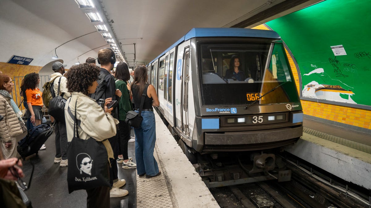 Line 6 metro arriving at Charles de Gaulle Etoile station and crowd of people waiting on the platform in Paris, France on 7 June 2024. (Photo by Antoine Boureau / Hans Lucas / Hans Lucas via AFP) (Photo by ANTOINE BOUREAU/Hans Lucas/AFP via Getty Images)
