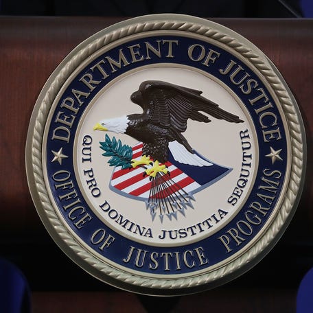The Justice Department seal is pictured during a Hate Crimes Subcommittee summit in Washington.