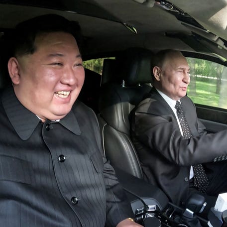 Russia's President Vladimir Putin and North Korea's leader Kim Jong Un ride an Aurus car in Pyongyang, North Korea in this image released by the Korean Central News Agency June 20, 2024.