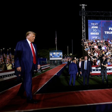 HIALEAH, FL - NOVEMBER 8: Former U.S. President Donald Trump walks to the stage to deliver remarks at The Ted Hendricks Stadium at Henry Milander Park on November 8, 2023 in Hialeah, Florida. Even as Trump faces multiple criminal indictments, he still maintains a commanding lead in the polls over other Republican candidates. (Photo by Alon Skuy/Getty Images)