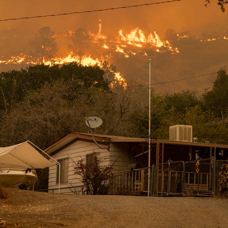 The French Fire comes close to destroying homes on August 24, 2021 in Wofford Heights, California.