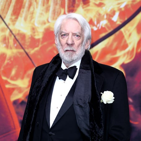 Donald Sutherland attends the world premiere of "The Hunger Games: Mockingjay - Part 2." Sutherland, who played President Snow in the franchise, has died at age 88.