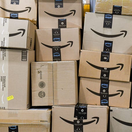 Amazon packages stacked on a cart on Tuesday, March 29, 2022, at an Amazon Delivery Station in Sioux Falls, South Dakota.
