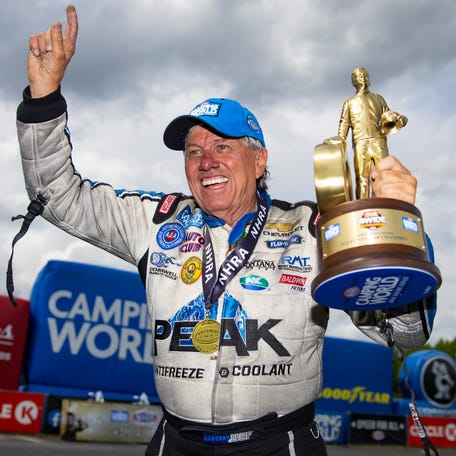 John Force celebrates after winning the Four Wide Nationals at zMax Dragway in Concord, North Carolina, on May 1, 2022.