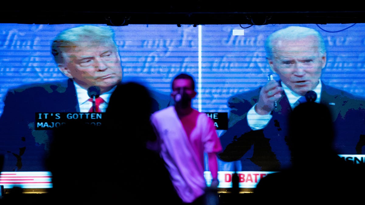 People watch the second 2020 presidential campaign debate between Democratic presidential nominee Joe Biden and U.S. President Donald Trump at The Abbey Bar in West Hollywood, California on October 22, 2020.