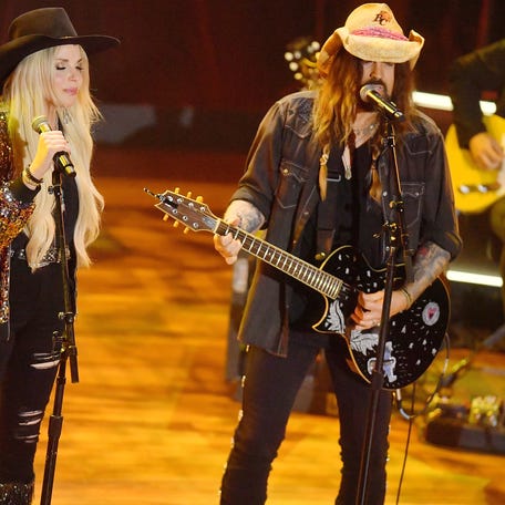 Firerose (left) and Billy Ray Cyrus perform onstage during the 16th Annual Academy of Country Music Honors at Ryman Auditorium on Aug. 23, 2023, in Nashville.