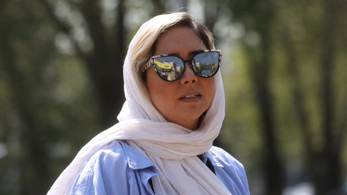 An Iranian woman looks on, on a street amid the implementation of the new hijab surveillance in Tehran, Iran, April 15, 2023. Majid Asgaripour/WANA (West Asia News Agency) via REUTERS