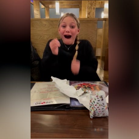 Girl surprised by her parents' pregnancy news