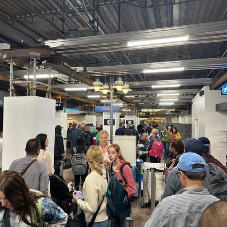 People wait to pass through the Transportation Security Administration checkpoint at Seattle-Tacoma International Airport on June 27, 2024.