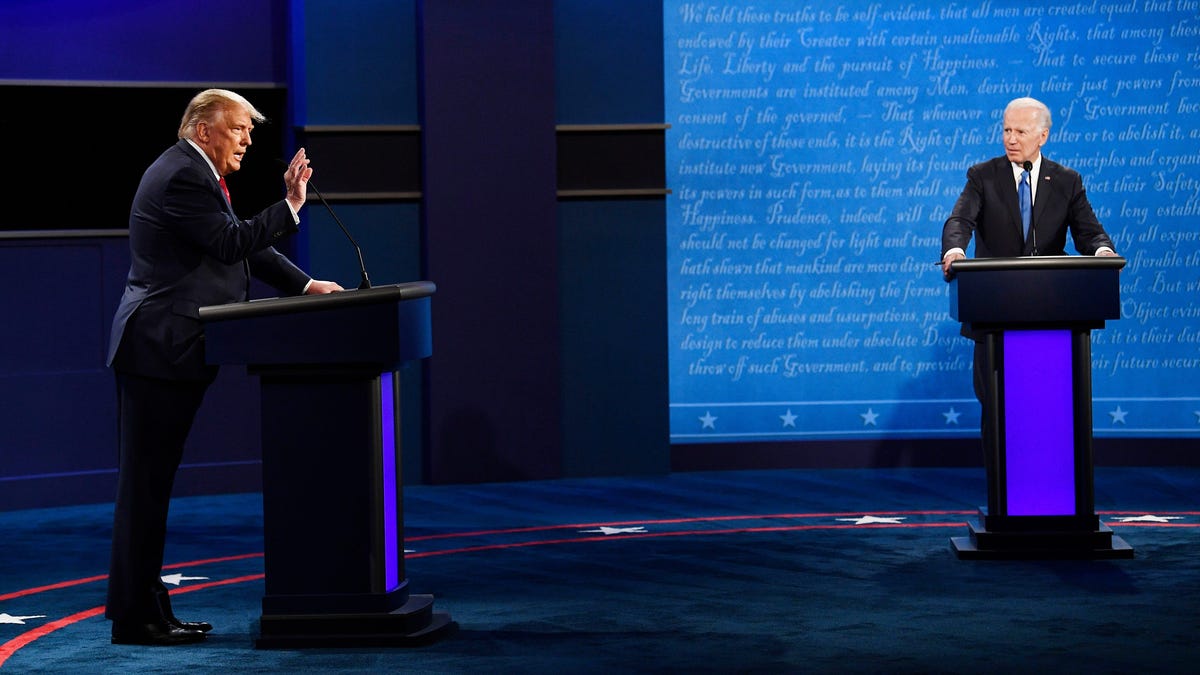 President Donald Trump speaks while Democratic presidential candidate former Vice President Joe Biden listens during the final presidential debate at the Curb Event Center at Belmont University in Nashville, Tenn., Thursday, Oct. 22, 2020.