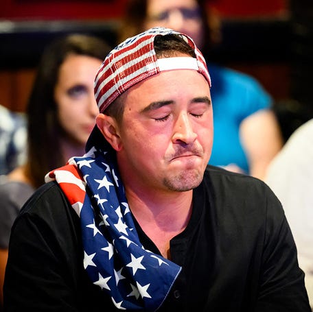 A patron reacts during a watch party for the first presidential debate of the 2024 presidential elections between President Joe Biden and former President and Republican presidential candidate Donald Trump at a pub in San Francisco, California, on June 27, 2024. The presidential debate is taking place in Atlanta, Georgia.