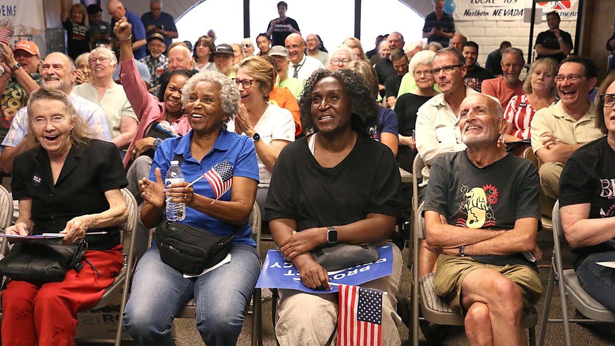 People react to something that President Biden said during the presidential debate at the Washoe County Democratic Party headquarters in Reno on June 27, 2024.