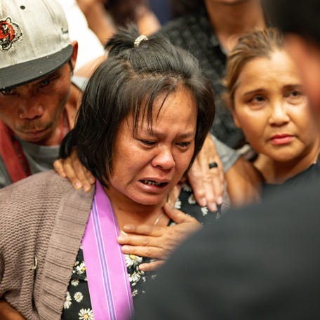 The mother of the 13 year old boy who was shot and killed by Utica Police cries after listening to a translator inside City Hall in Utica, NY on Saturday, June 29, 2024.