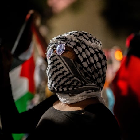 Students and demonstrators protest the war in Gaza after walking out of commencement at the DKR-Texas Memorial Stadium on May 11, 2024 in Austin, Texas.