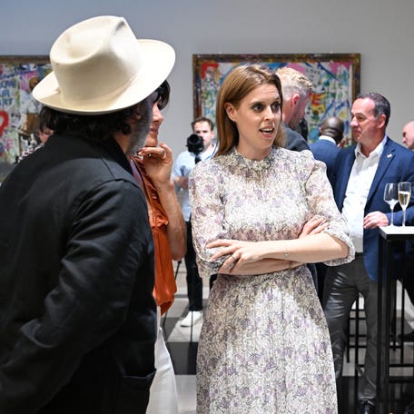 Mr. Brainwash, Natalie Pinkham and Princess Beatrice of York attend the presentation of Mr. Brainwash by Clarendon Fine Art and Jack Barclay Bentley on July 1, 2024, in London.