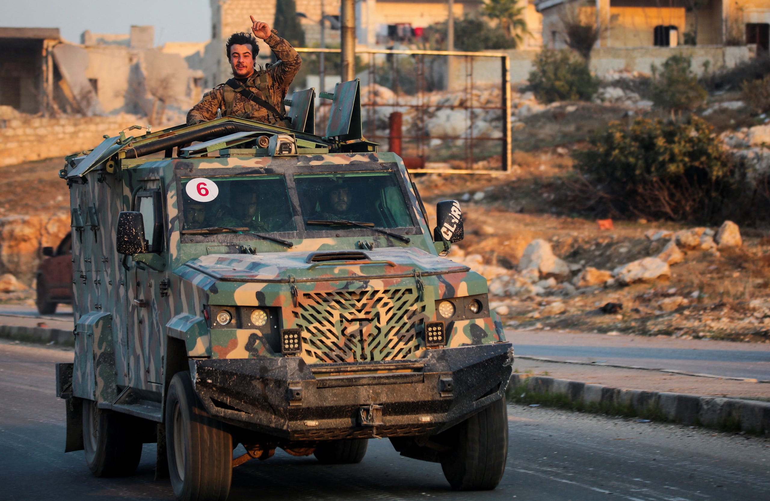 A rebel led by the Islamist militant group Hayat Tahrir al-Sham stands in the back of a vehicle in al-Rashideen, Aleppo province, Syria November 29, 2024. REUTERS/Mahmoud Hasano Show less MAHMOUD HASANO, REUTERS