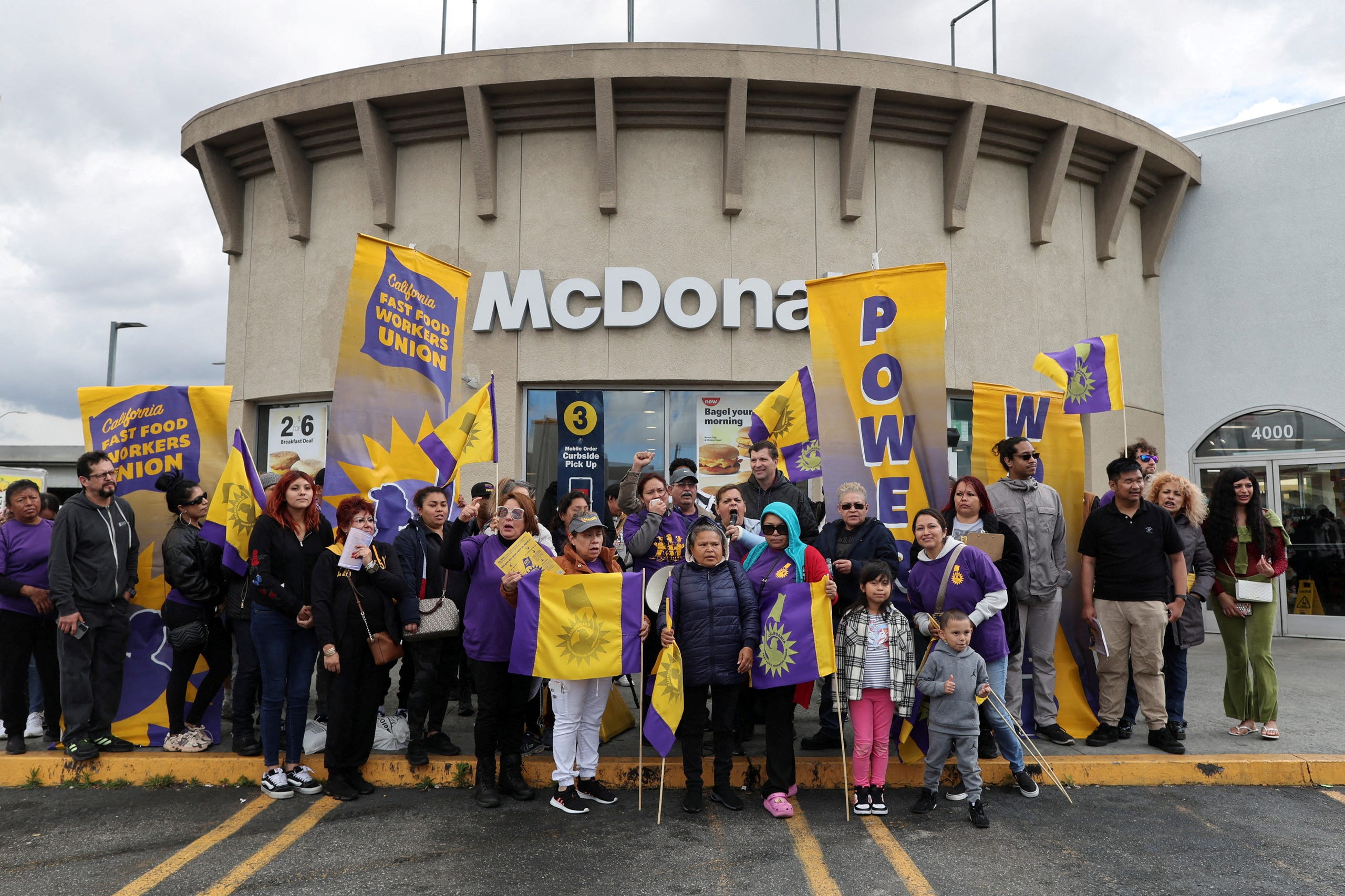 California fast food workers hold a rally as they celebrate their minimum wage increase to $20 an hour during an event in Los Angeles, California, … Show more AUDE GUERRUCCI, REUTERS