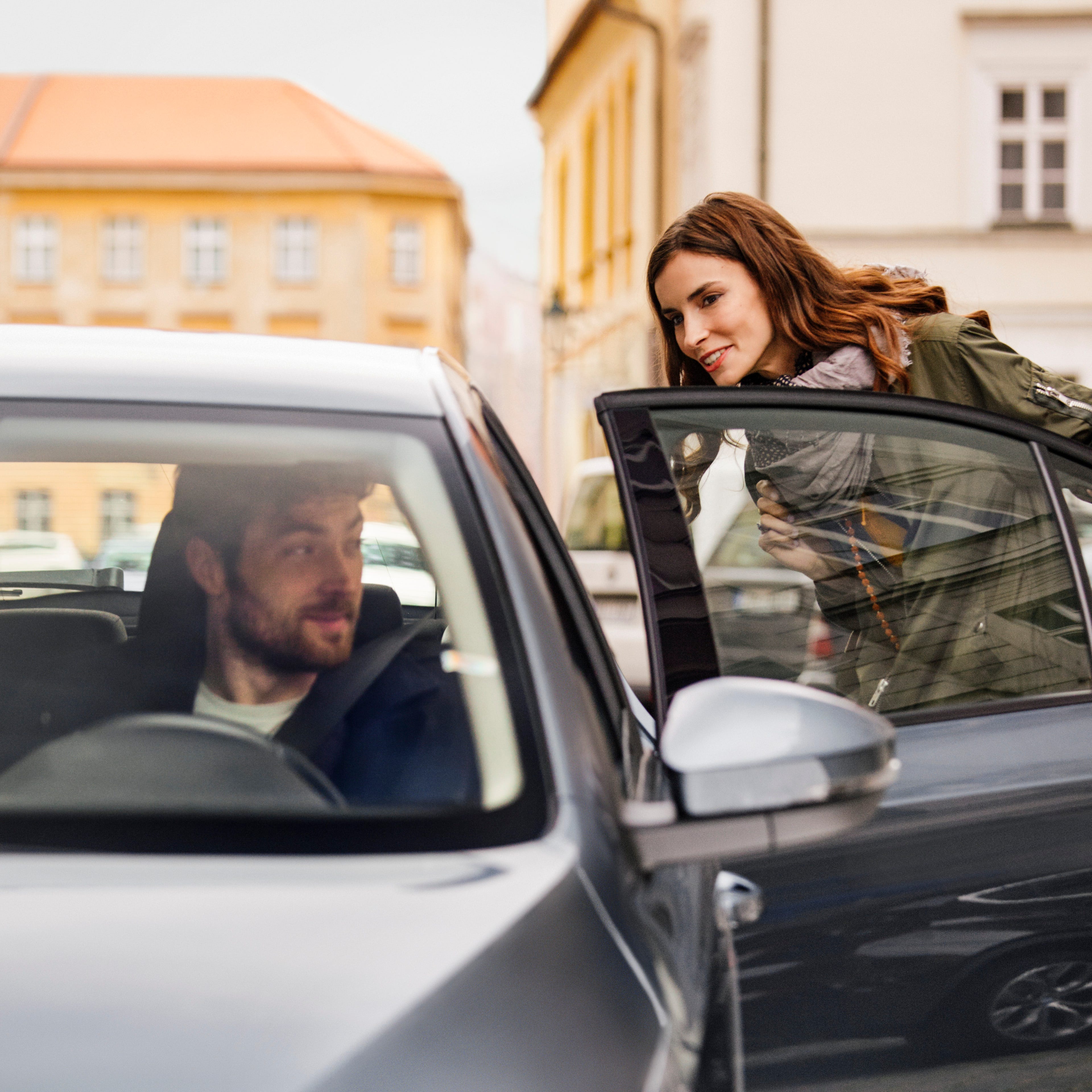 An Uber driver picks up a passenger.