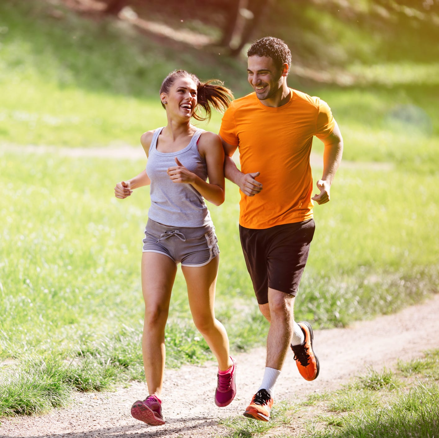 Two people jogging outdoors.